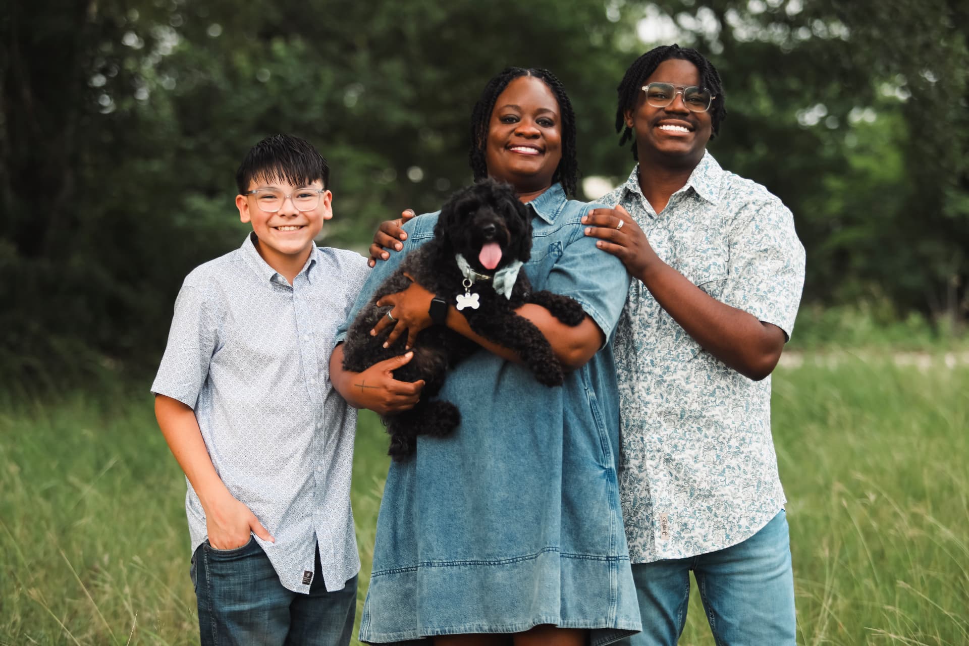 Pastor Ashley Berry with her sons Caiden and Landon, and Oakley James, the family dog